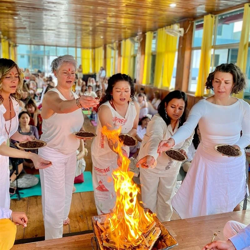 Yoga practitioner performing hawan ceremony in Rishikesh