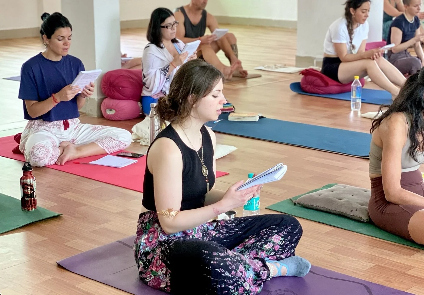 Yoga Student Reading FAQs About Yoga Teacher Training